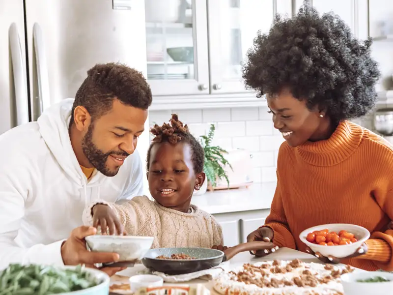 Family making a pizza